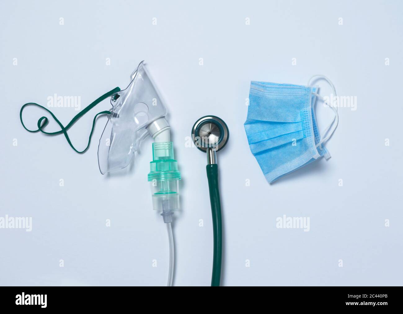 Studio shot of breathing device, stethoscope and surgical mask Stock Photo