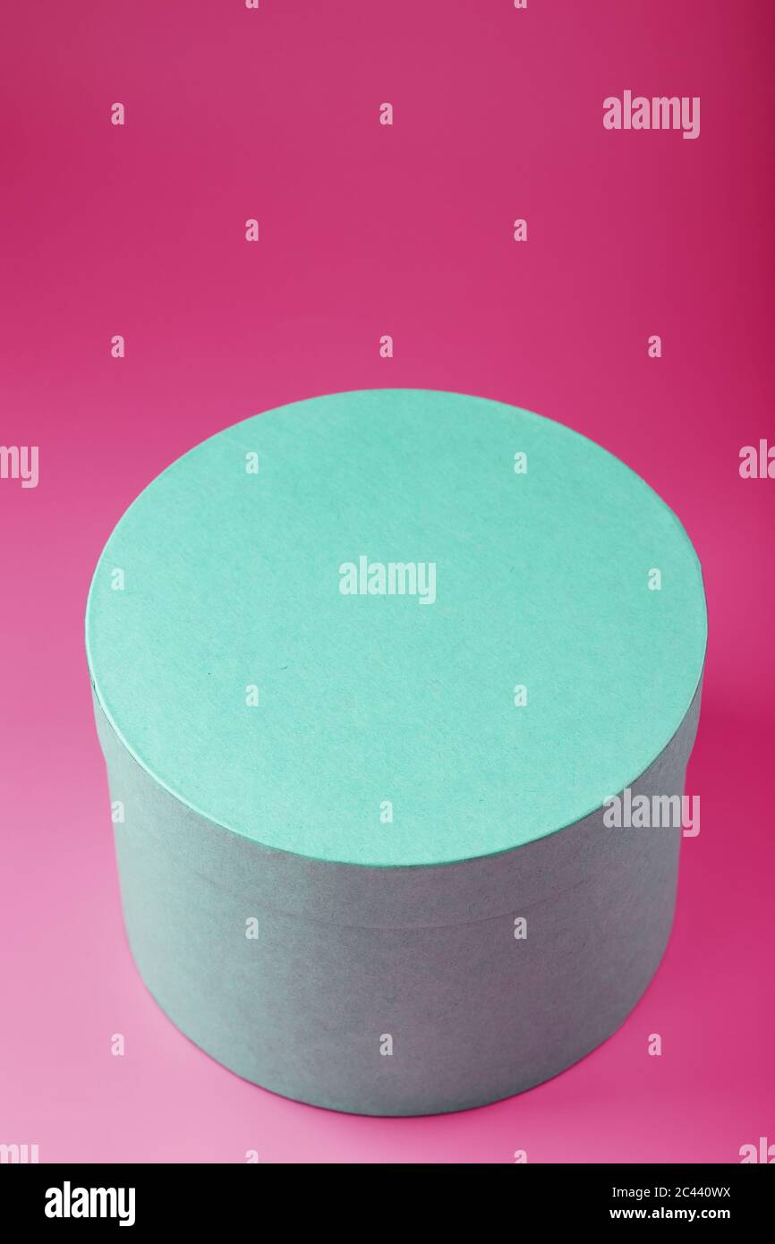 Round Box on pink background for gift. Stock Photo