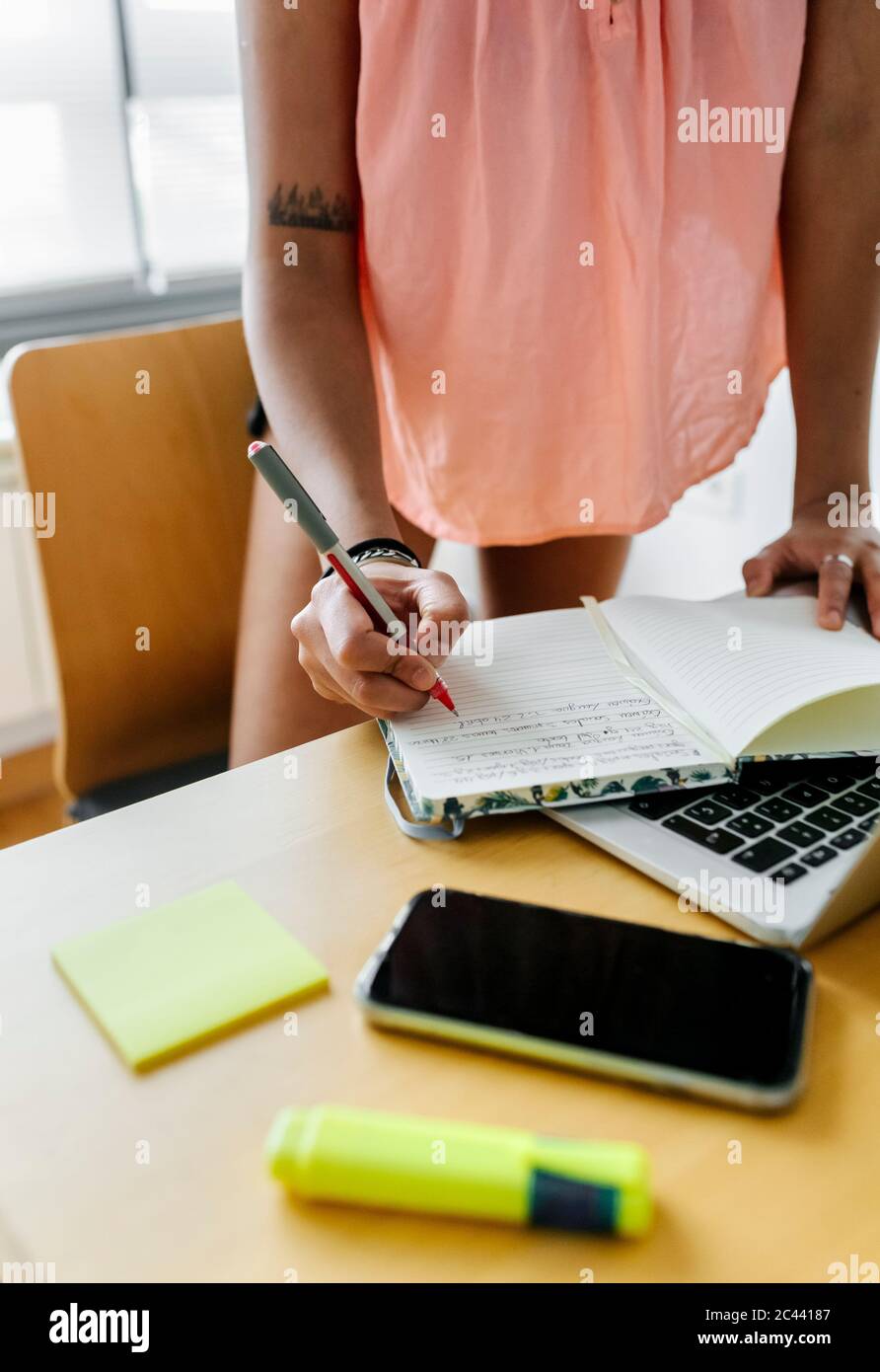 Taking Notes Photographic Student taking notes from phone hi-res stock photography and images - Alamy
