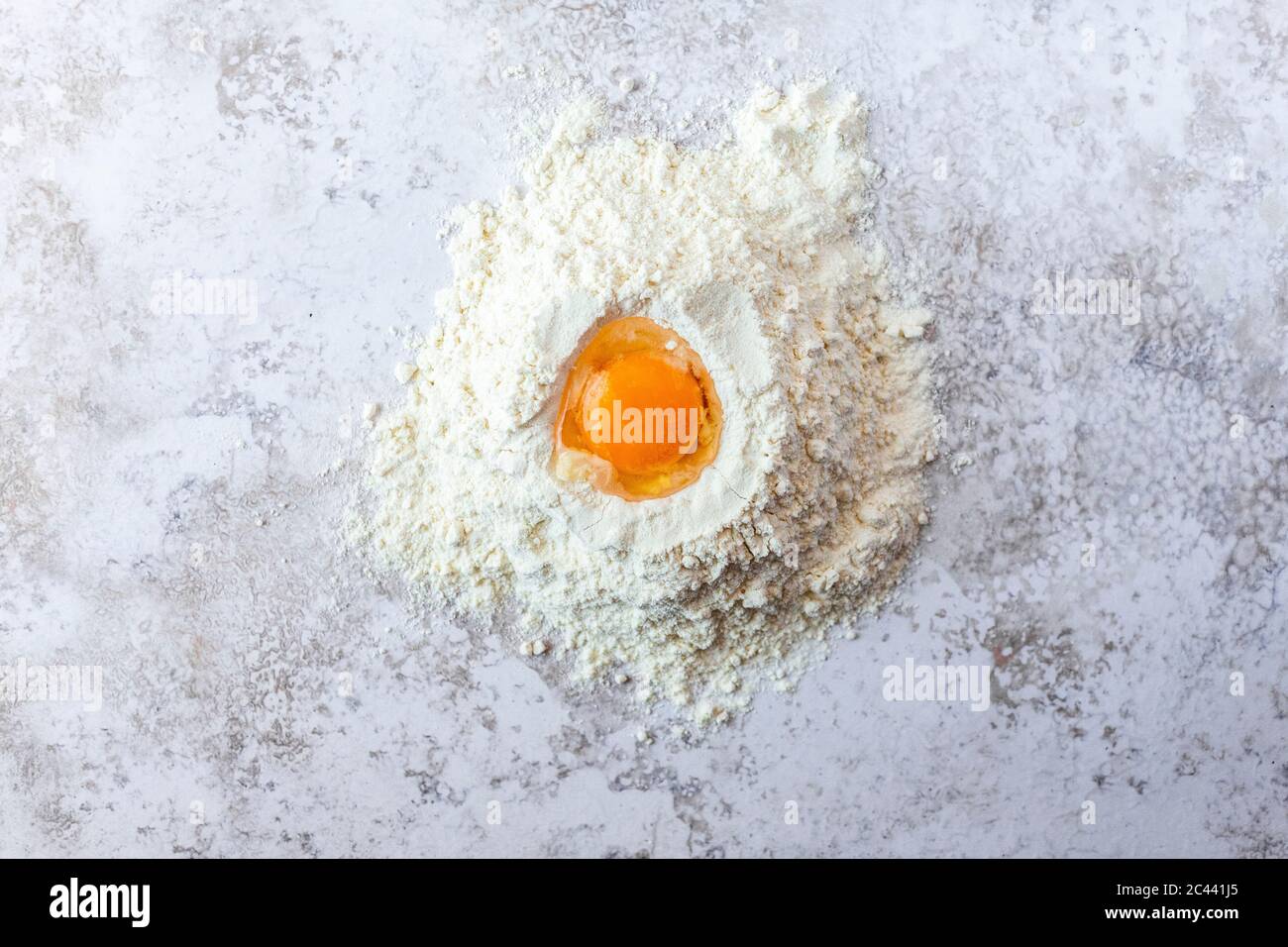 Closeup of egg yolk in flour Stock Photo Alamy