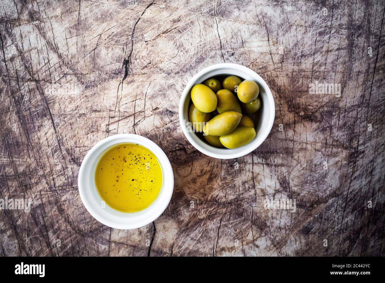 Bowls of olive oil and fresh olives Stock Photo Alamy