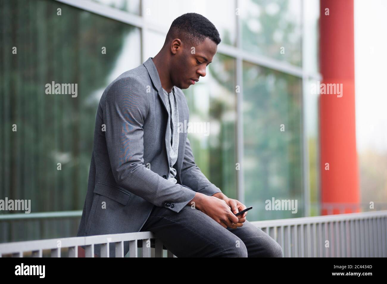 Businessman using smartphone Stock Photo