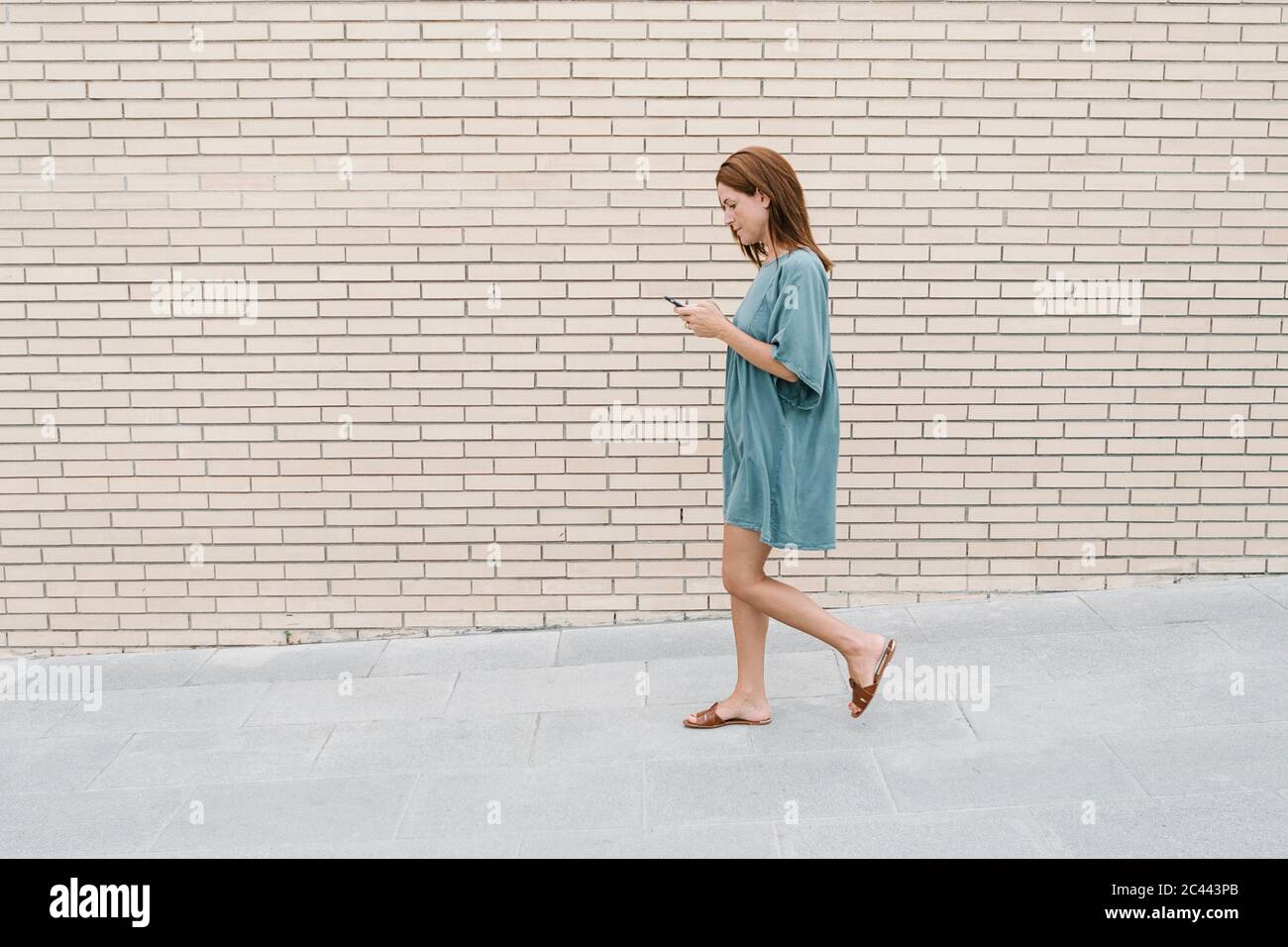 Attractive woman walking street hi-res stock photography and images - Alamy