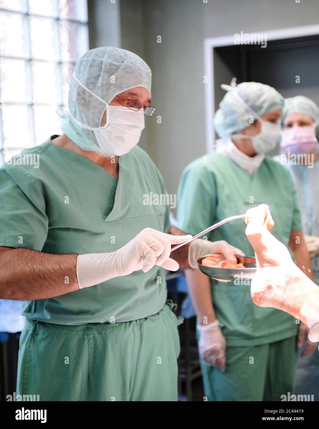 Surgeon operates on one foot Stock Photo