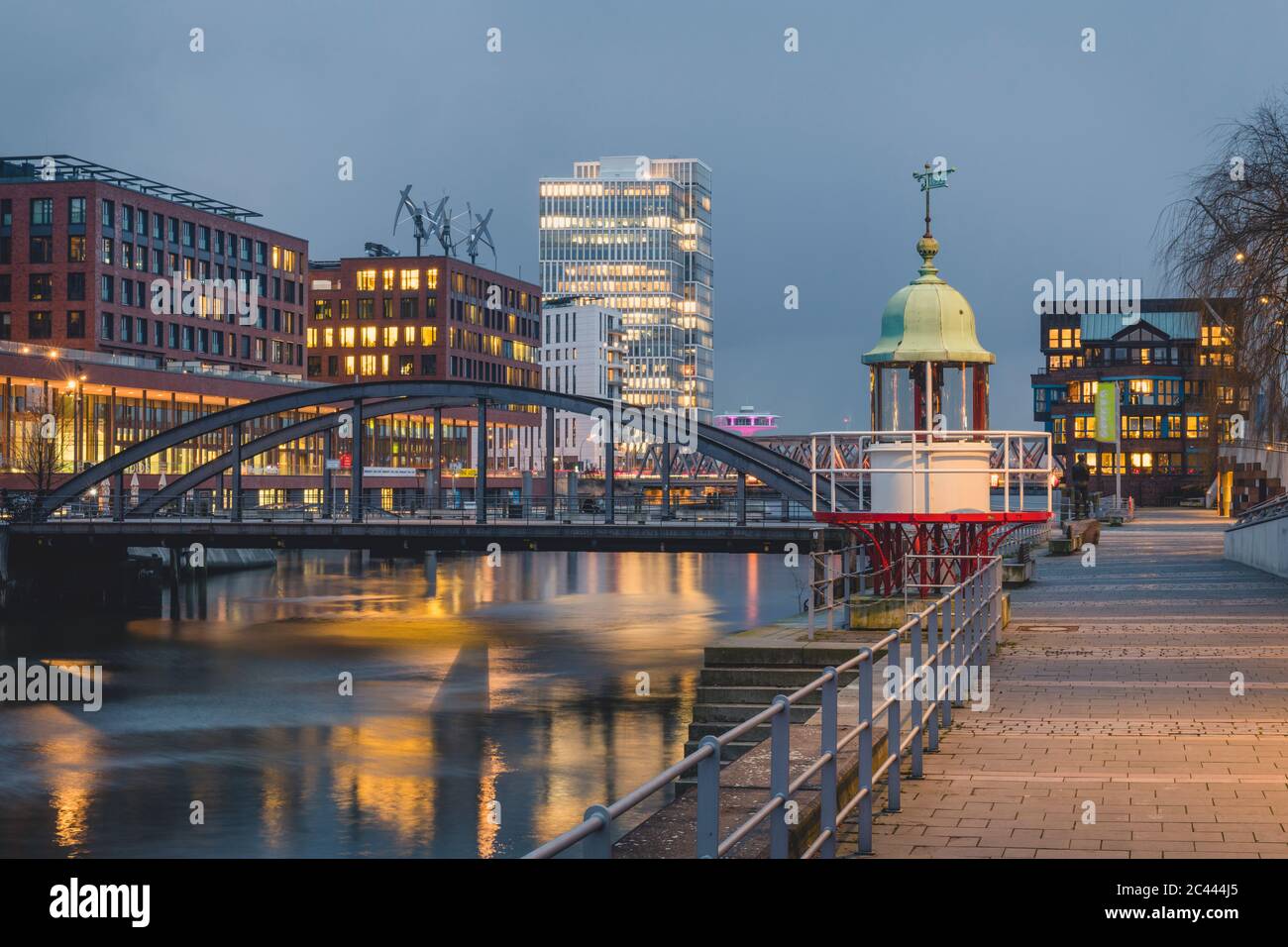 Germany, Hamburg, Bridge over Elbe river canal at dusk Stock Photo