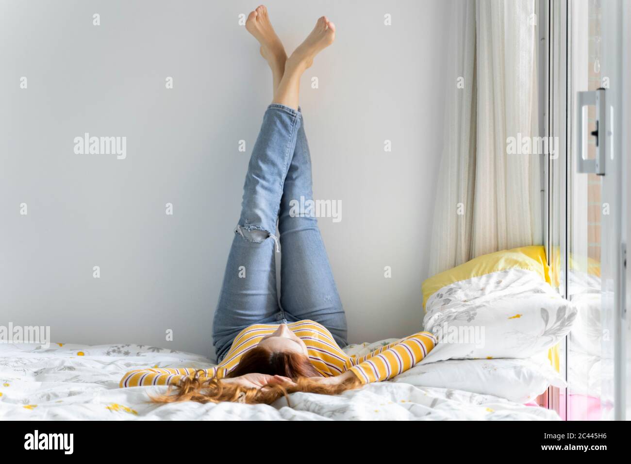 Feet woman lying in bed hires stock photography and images Alamy