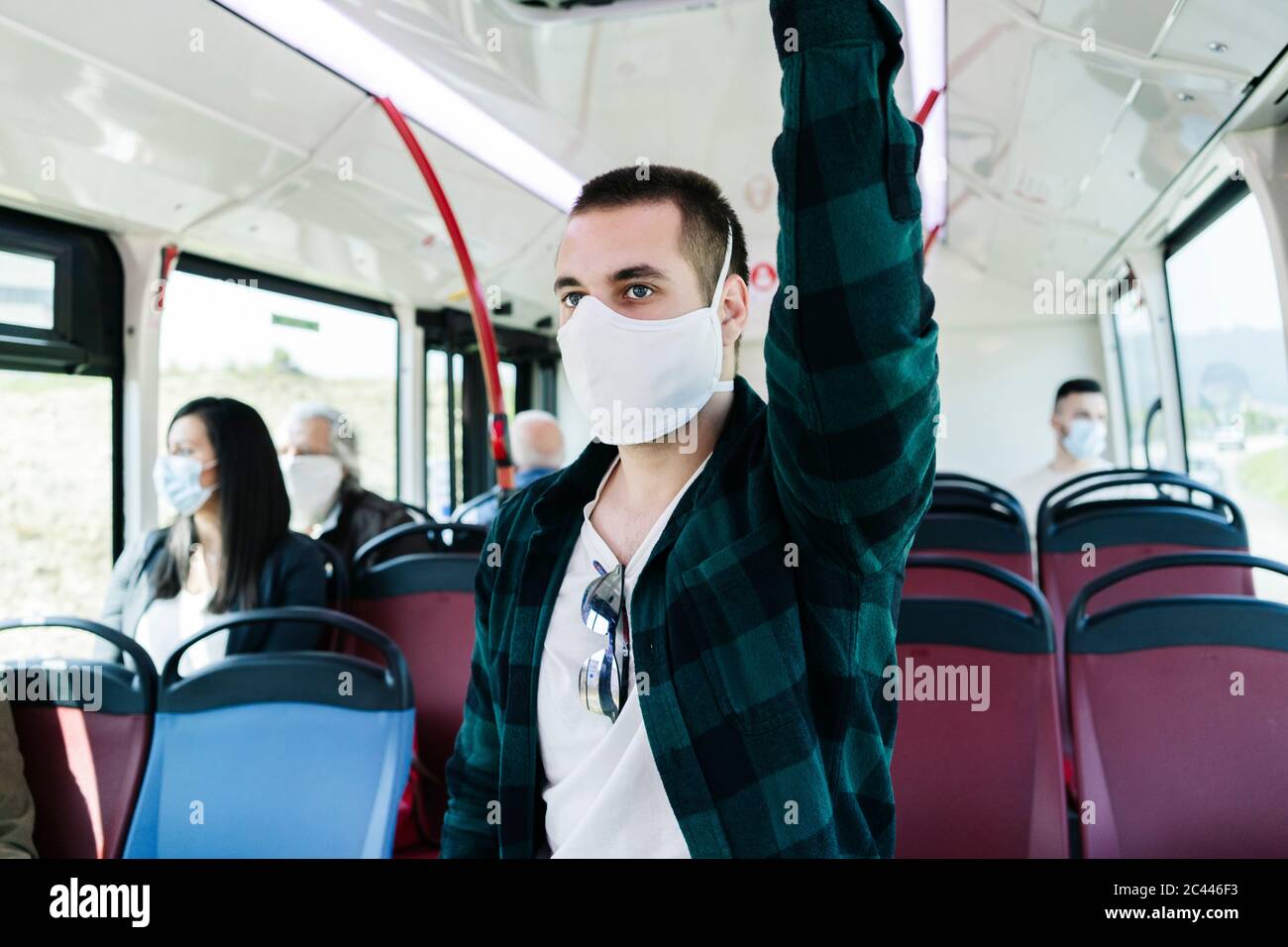 Portrait young man wearing protective mask public bus hires stock