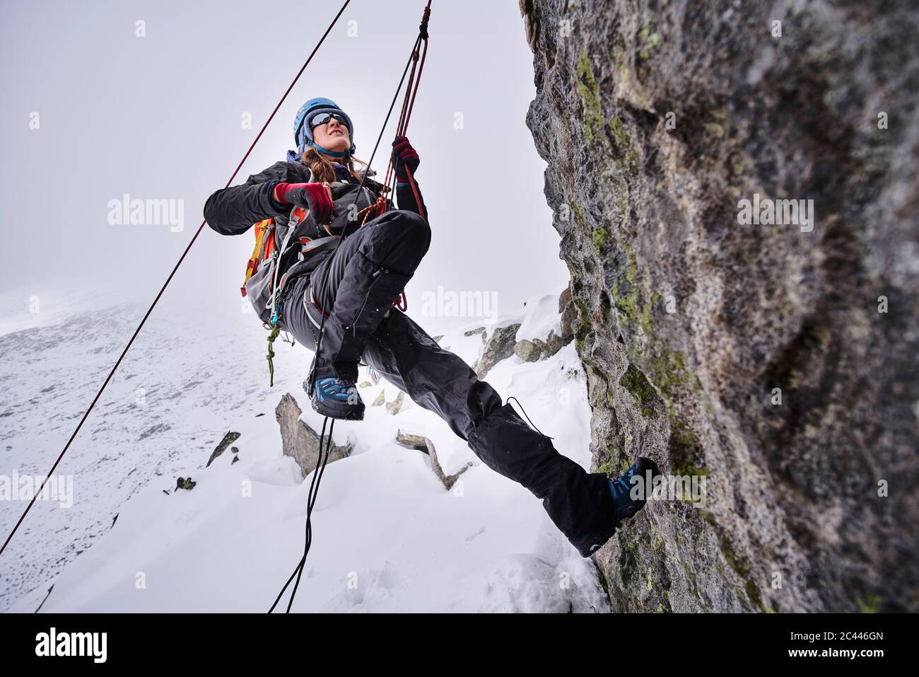 Mature woman climbing at Grossvendediger, Tyrol, Austria Stock Photo