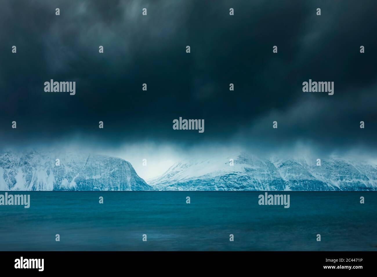 Cloudy atmosphere at the coast in winter, Fjord Lyngen, Skibotn, Norway Stock Photo