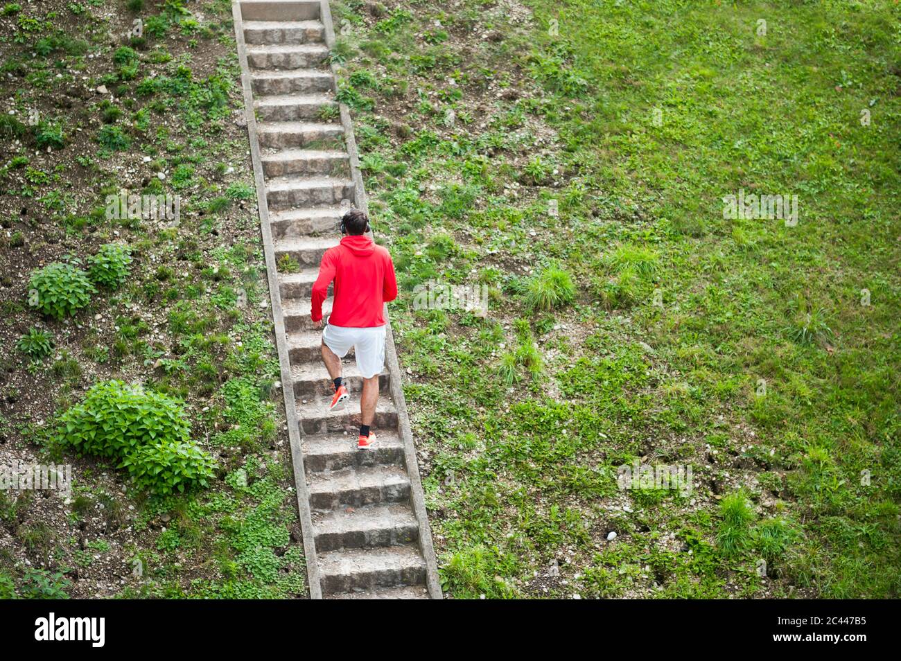 Young man running up stairs Stock Photo Alamy