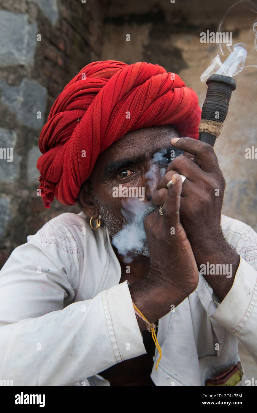 The image of Shepherds smoking  in the village of Jawai-Bera, Rajasthan, India, asia Stock Photo