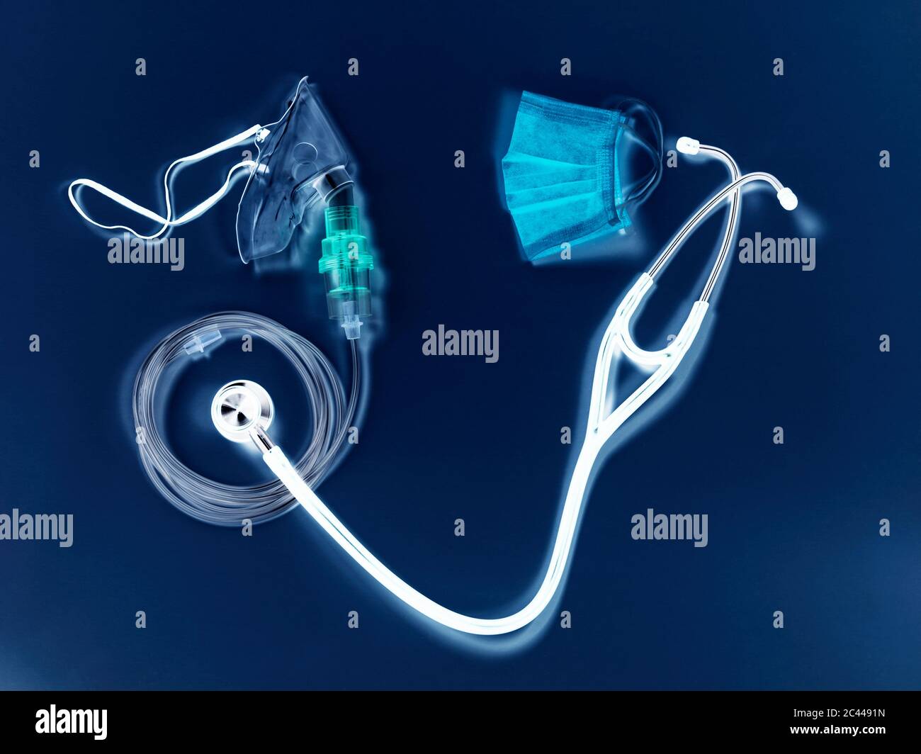 Studio shot of breathing device, stethoscope and surgical mask Stock Photo