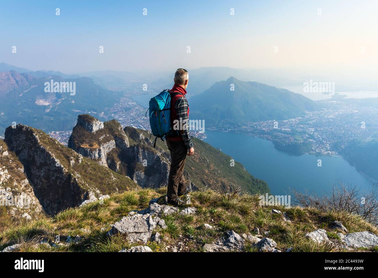 Rear view hiker on mountaintop hi-res stock photography and images - Alamy