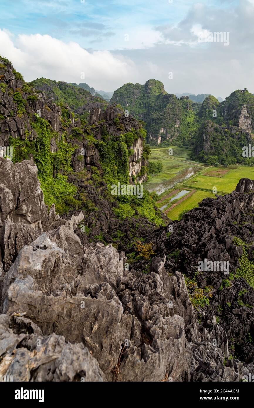 Vietnam, Ninh Binh Province, Ninh Binh, Scenic view of forested karst formations in Hong River Delta Stock Photo