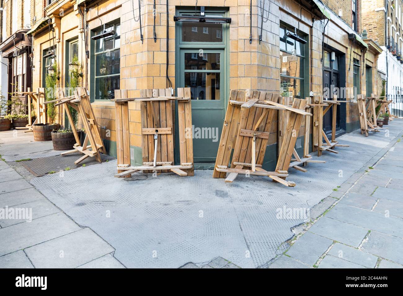UK, England, London, Overturned tables outside closed pub during COVID-19 pandemic Stock Photo