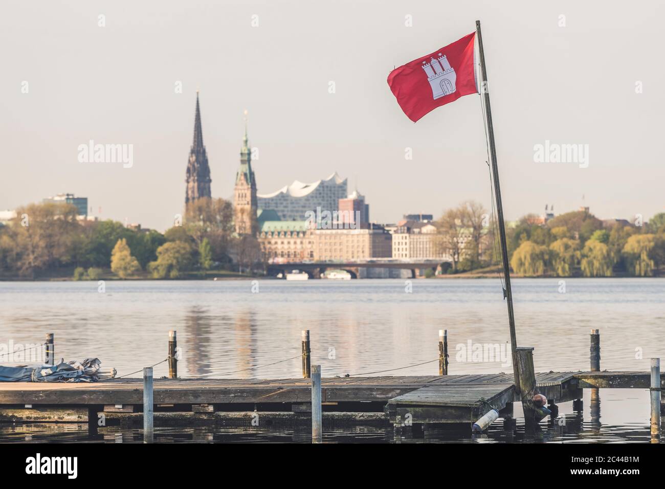 Germany, Hamburg, Flag of Hamburg attached to small jetty on shore of Outer  Alster Lake Stock Photo - Alamy