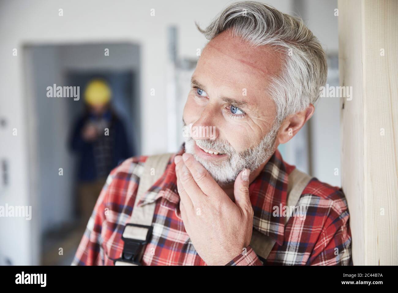 Portrait of smiling construction worker at construction site Stock ...