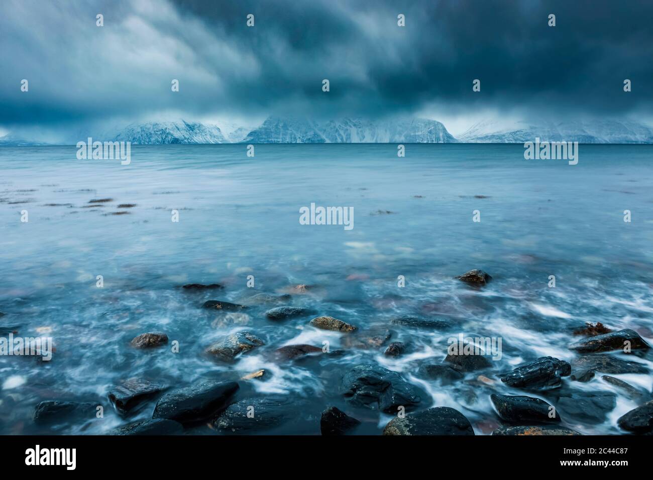 Cloudy atmosphere at the coast in winter, Fjord Lyngen, Skibotn, Norway Stock Photo