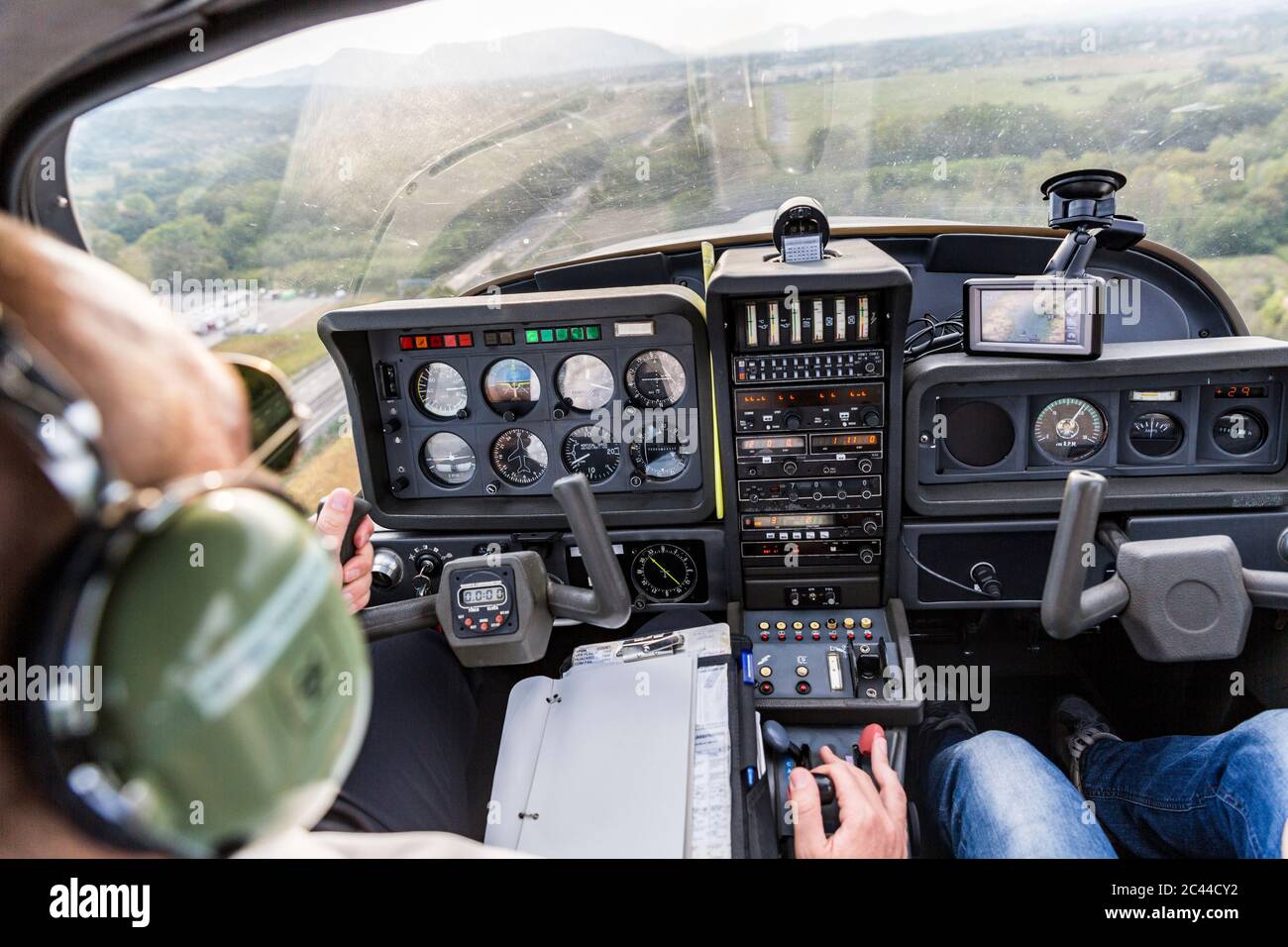 Pilot and copilot navigating sports plane, rear view Stock Photo