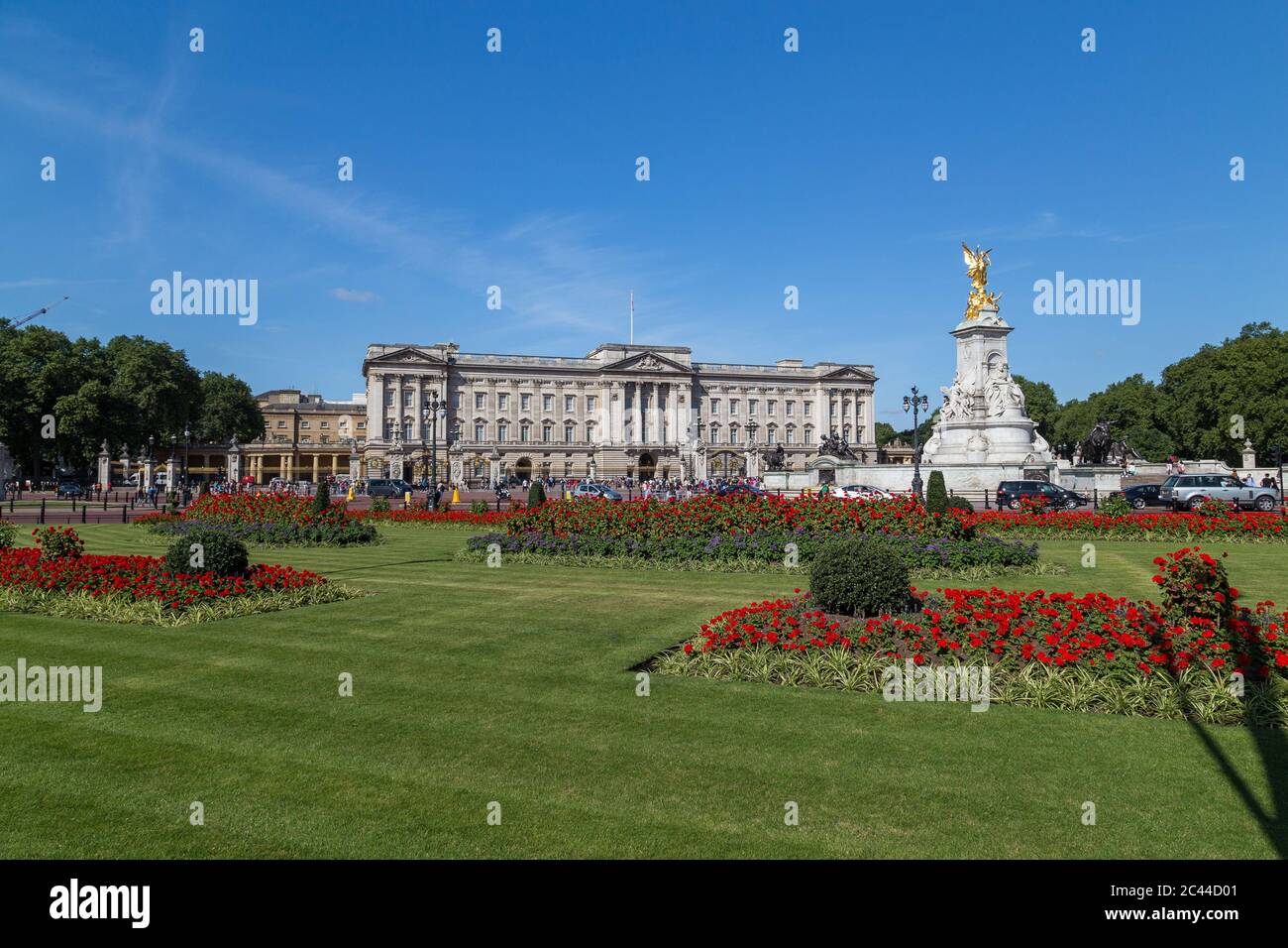 LONDON, UK - 18TH JULY 2015: Buckingham Palace in London during the summer showing the buildings and flowers. People can be seen outside. Stock Photo