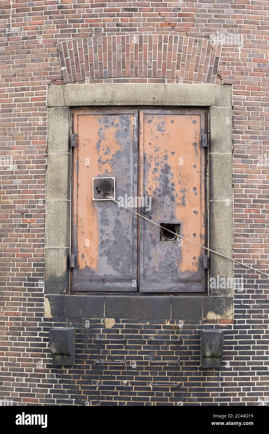 Gate, rope and brick wall Stock Photo