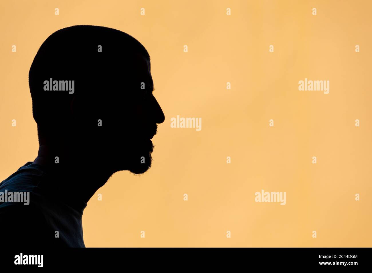 Silhouette of man against yellow background Stock Photo