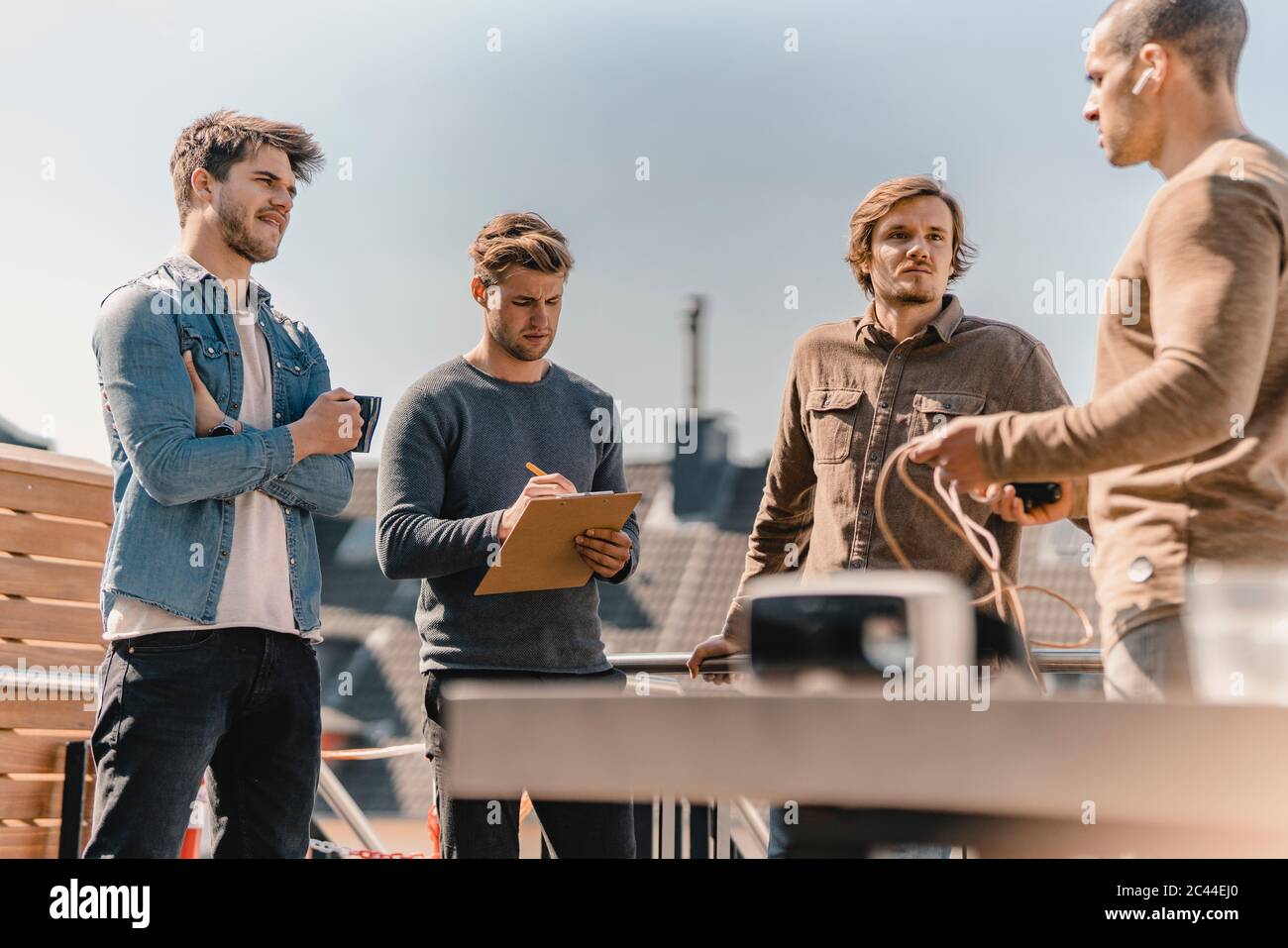 Young entrepreneurs brainstorming on a roof terrace Stock Photo