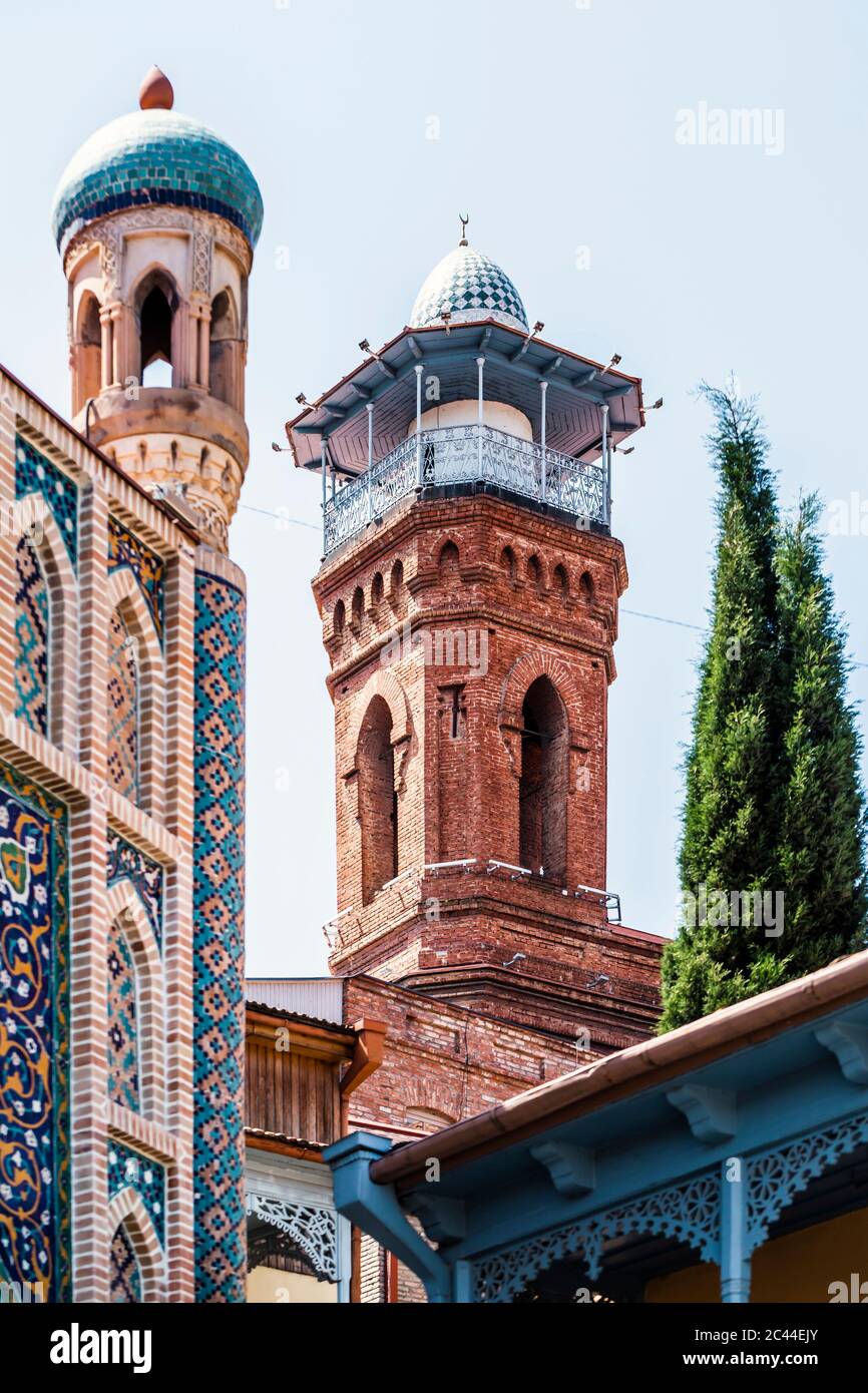 Minaret of Jumah Mosque against clear sky in Tbilisi, Georgia Stock Photo