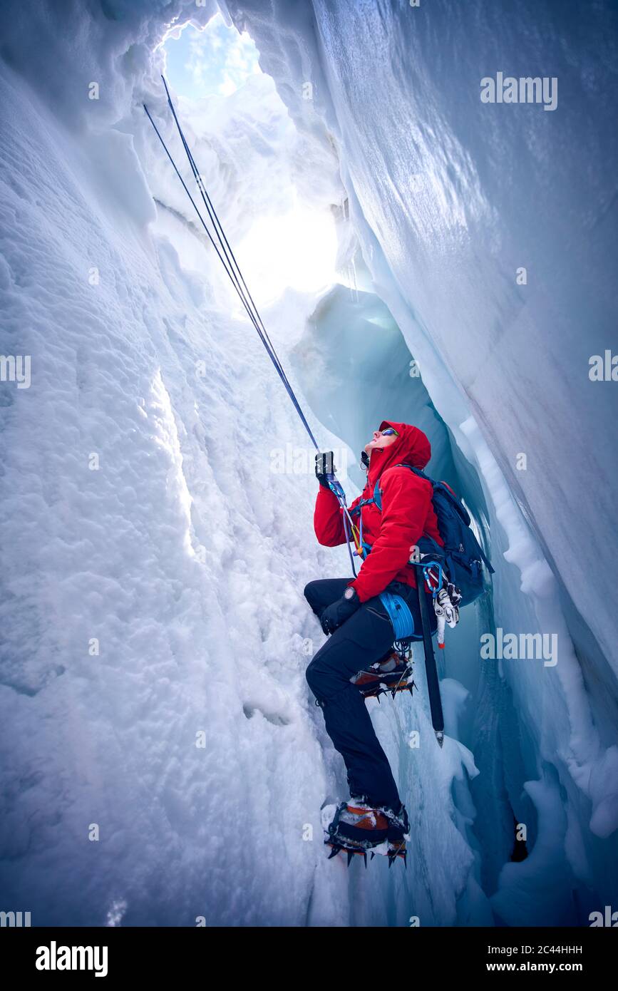 Mountaineer climbing up narrow hi-res stock photography and images - Alamy