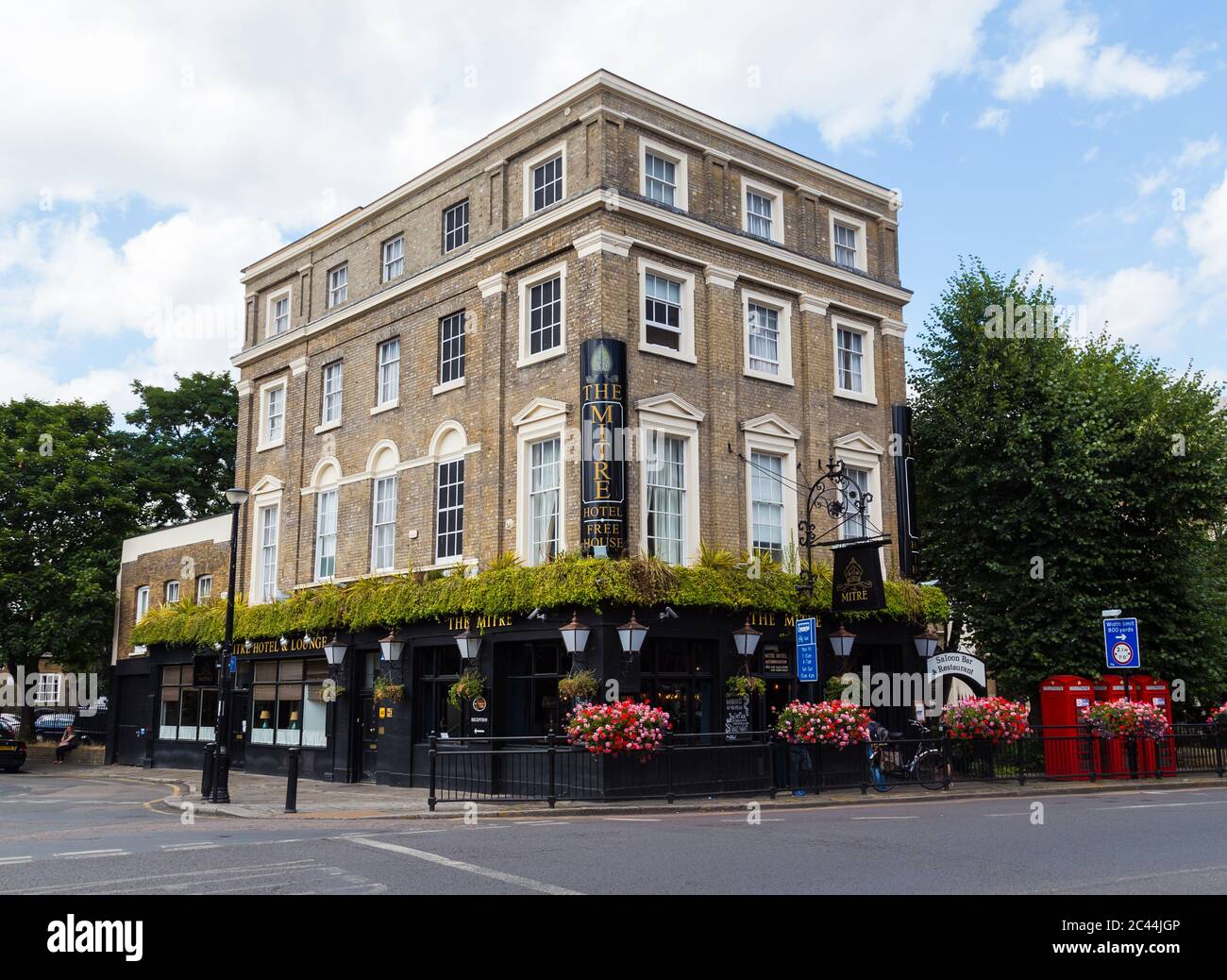 LONDON, UK - 21ST JULY 2015: The outside of the Mitre pub in London during the day. People can be seen outside. Stock Photo