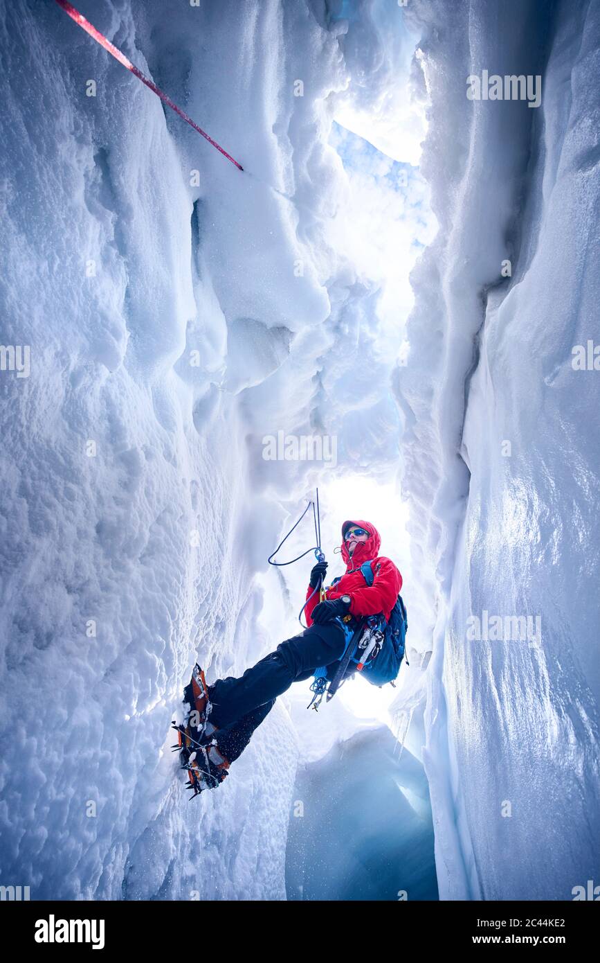 Mountaineer climbing in crevasse, Glacier Grossvendediger, Tyrol, Austria Stock Photo