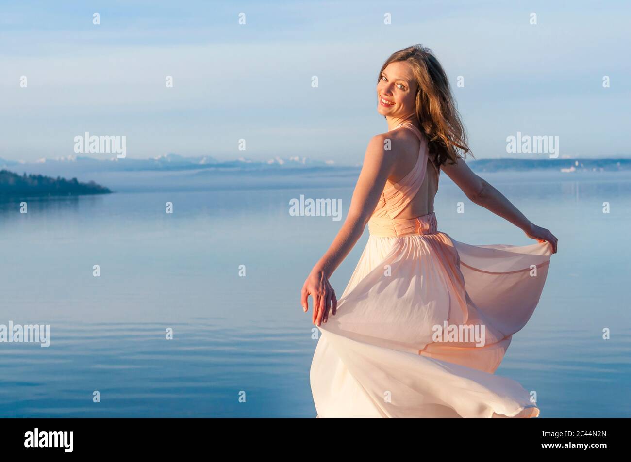 Woman standing rear view dress hi-res stock photography and images - Alamy