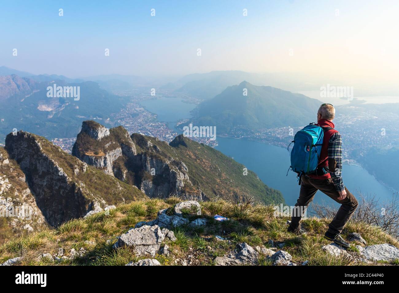 Rear view hiker on mountaintop hi-res stock photography and images - Alamy
