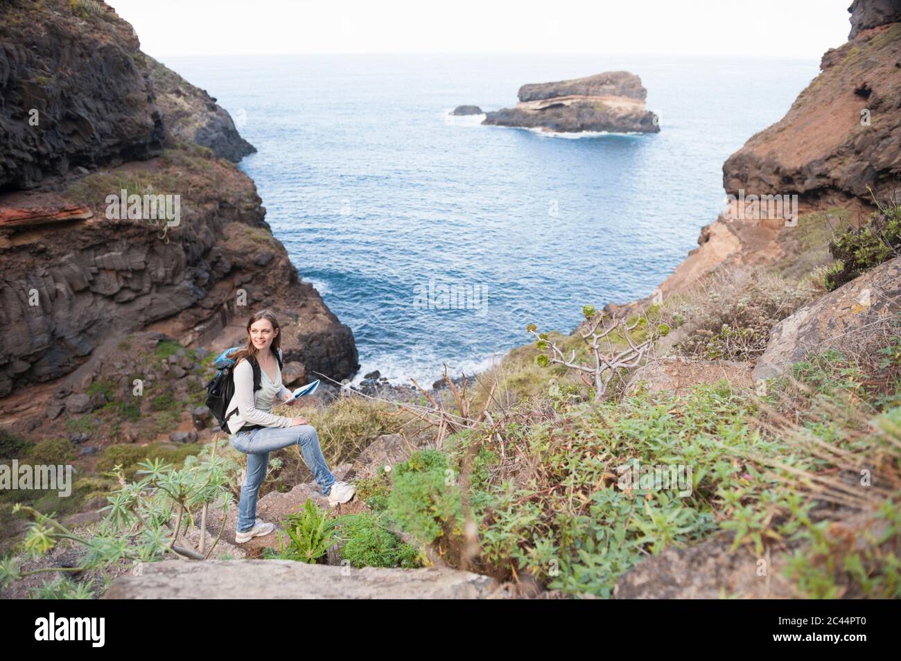 Female hiker with map, Tenerife, Balearic Islands, Spain Stock Photo