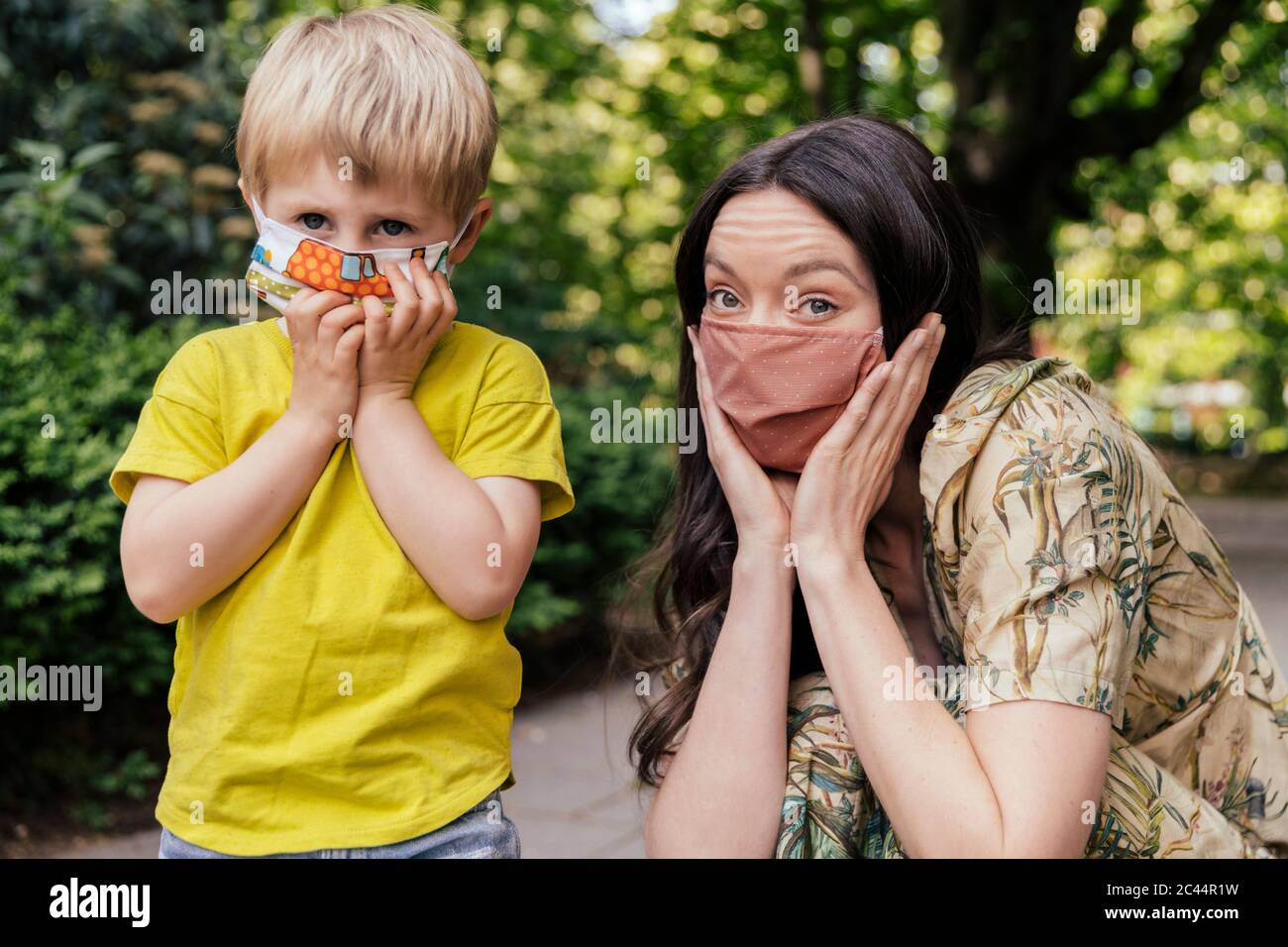 Portrait of mother and son wearing a face masks Stock Photo - Alamy
