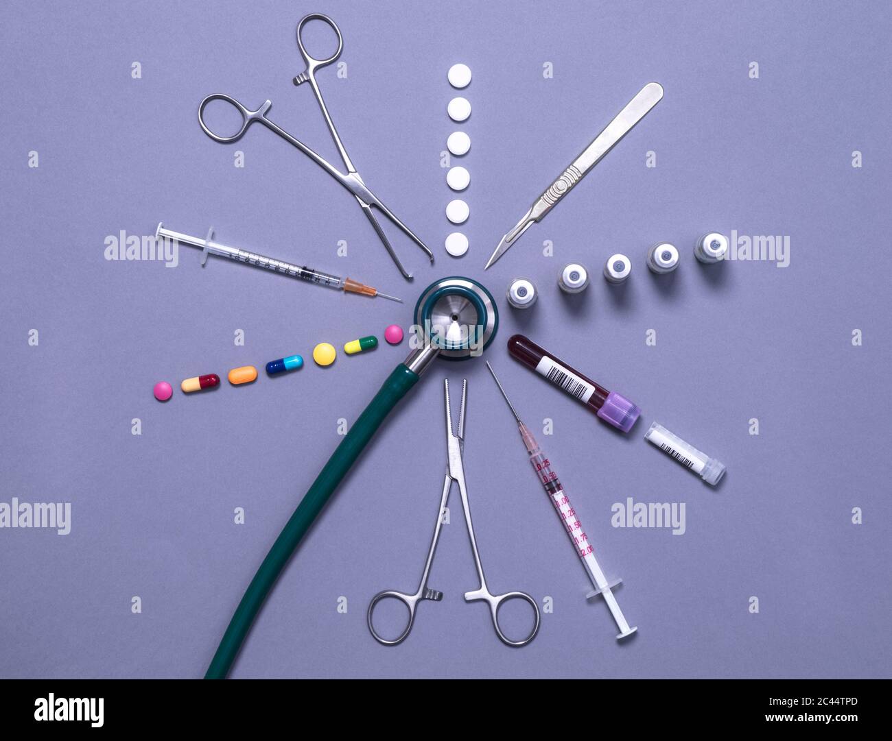 Stethoscope surrounded by an assortment of medical equipment and ...