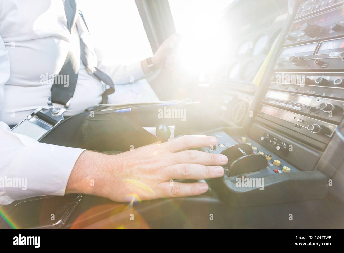 Pilot flying in sports plane, using control wheel Stock Photo