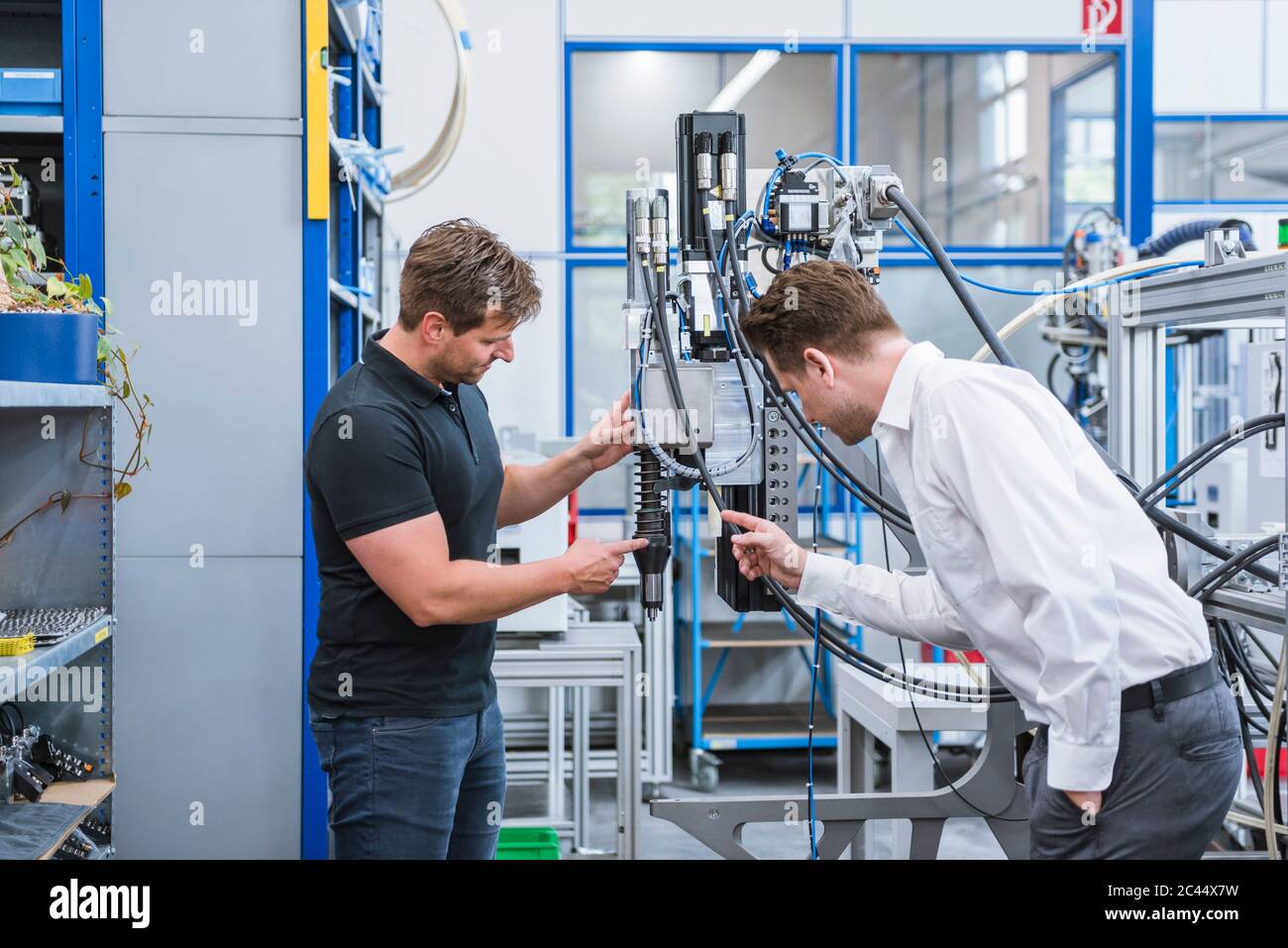Two Guys Inventing Machine Two men having hi-res stock photography and images - Alamy