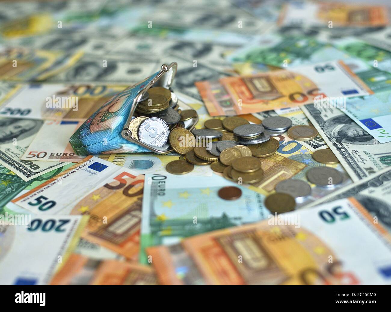 coins fall from the wallet to the table Stock Photo