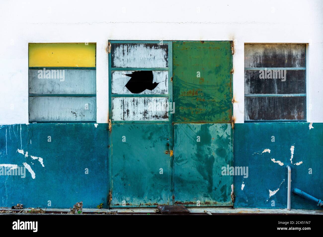 Windows in facade of an neglected workshop Stock Photo