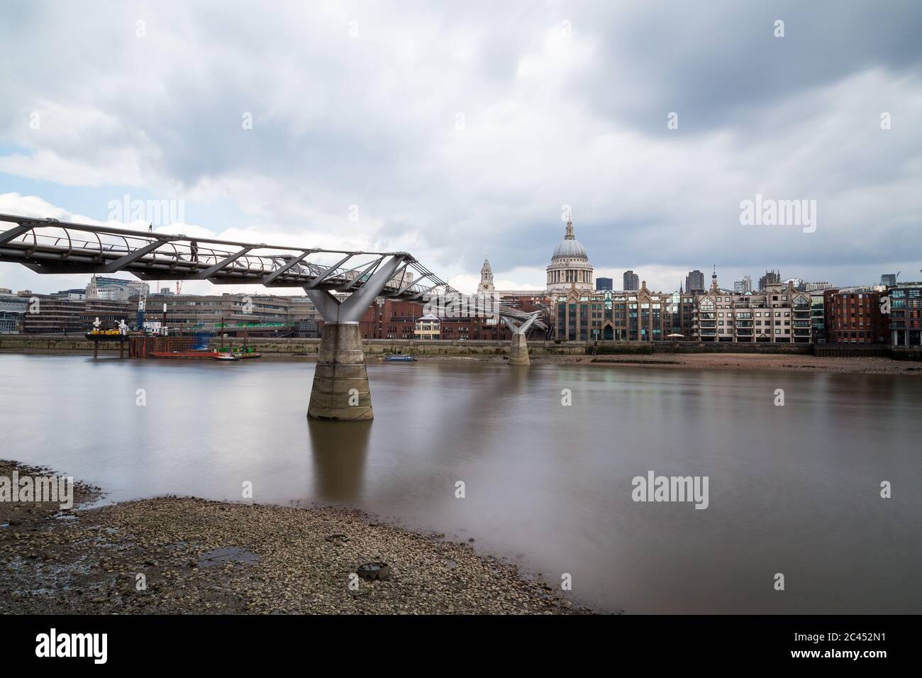 St Paul's Cathedral and Millenium Bridge in London during the day. Taken with a long exposure Stock Photo