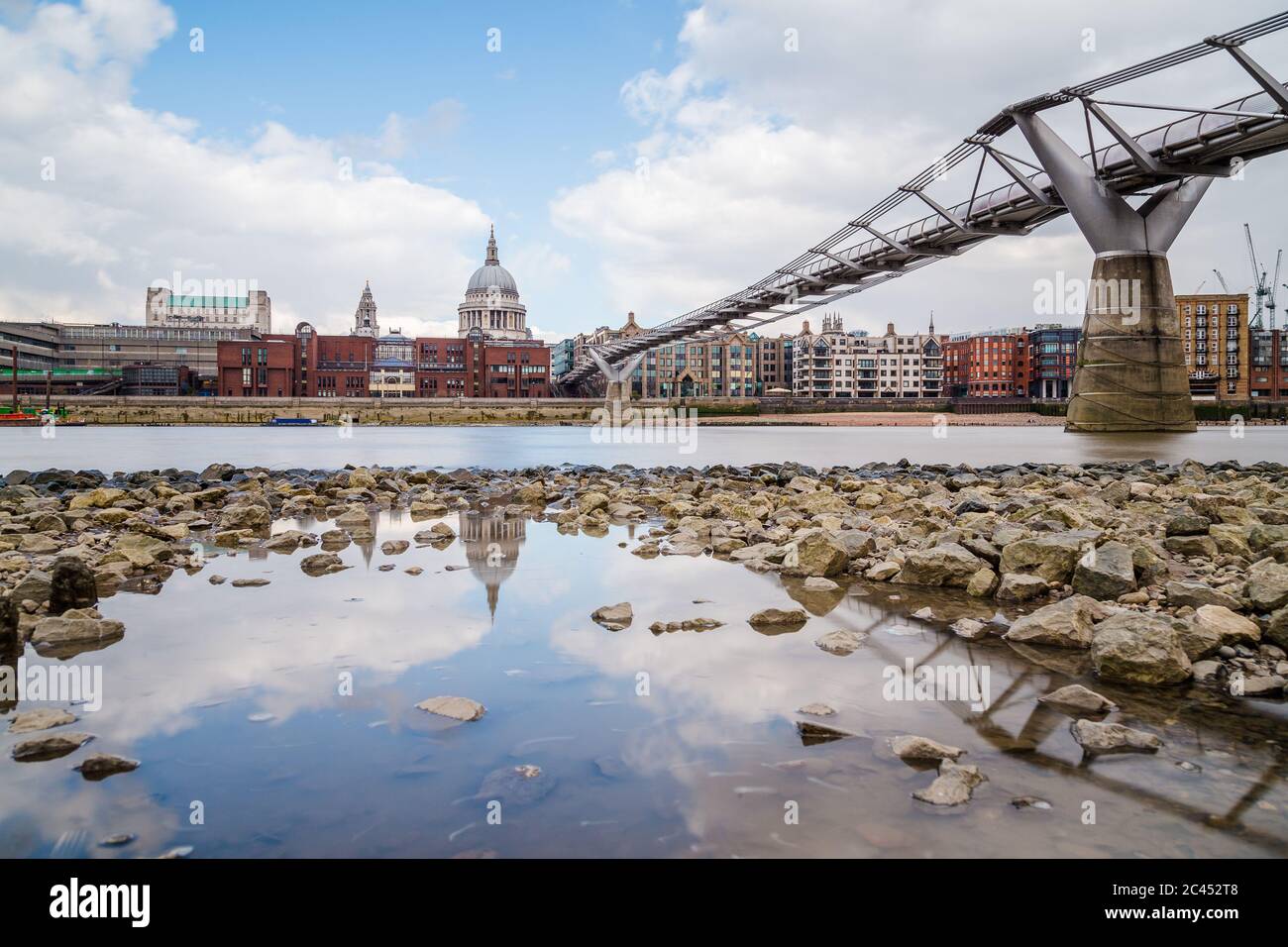 St Paul's Cathedral and Millenium Bridge in London during the day. Taken with a long exposure Stock Photo
