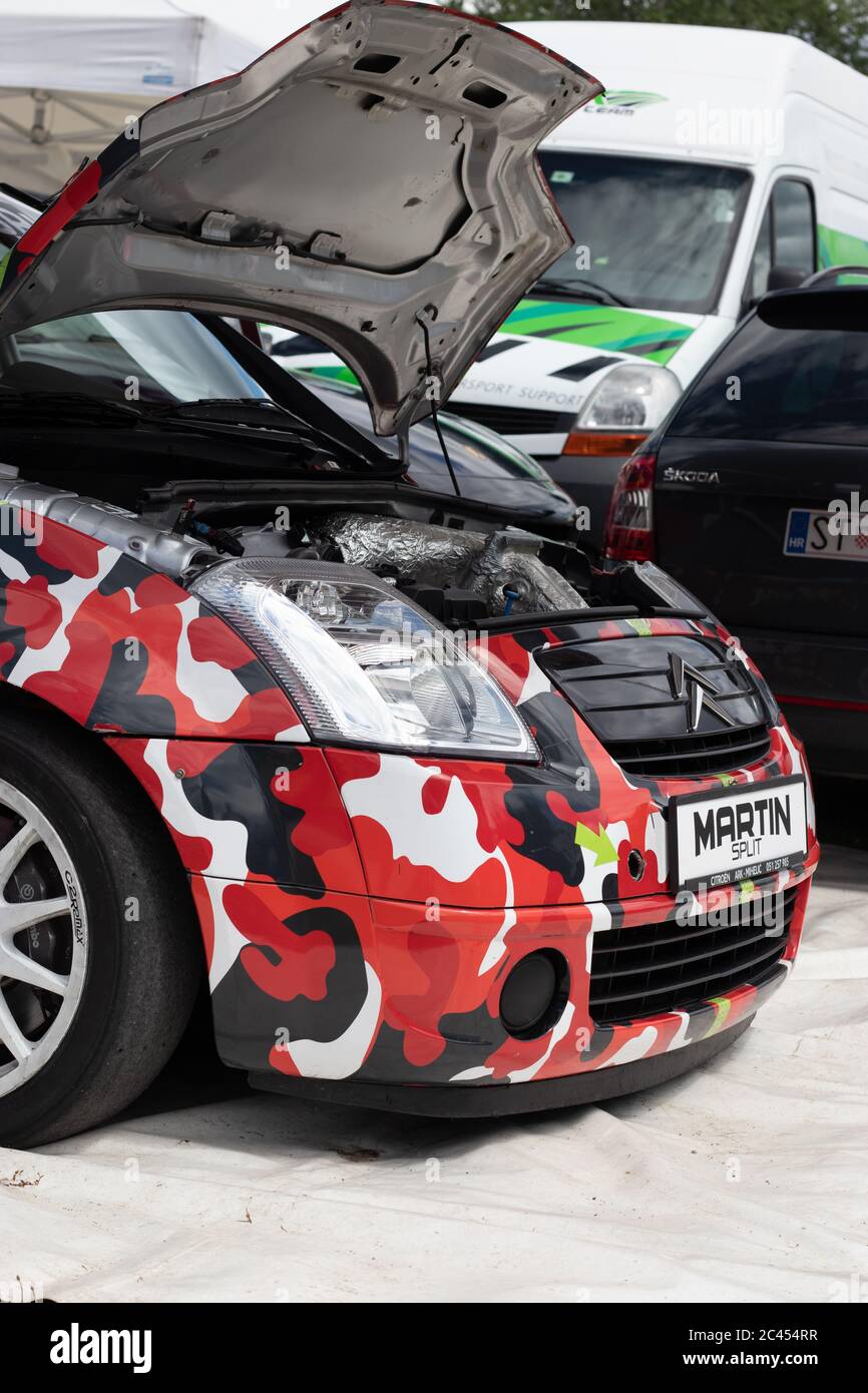 Skradin Croatia, June 2020 Citroen C2 racecar with jumbo red tiger camouflage pattern parked in a race car paddock, prepairing for hillclimb race Stock Photo