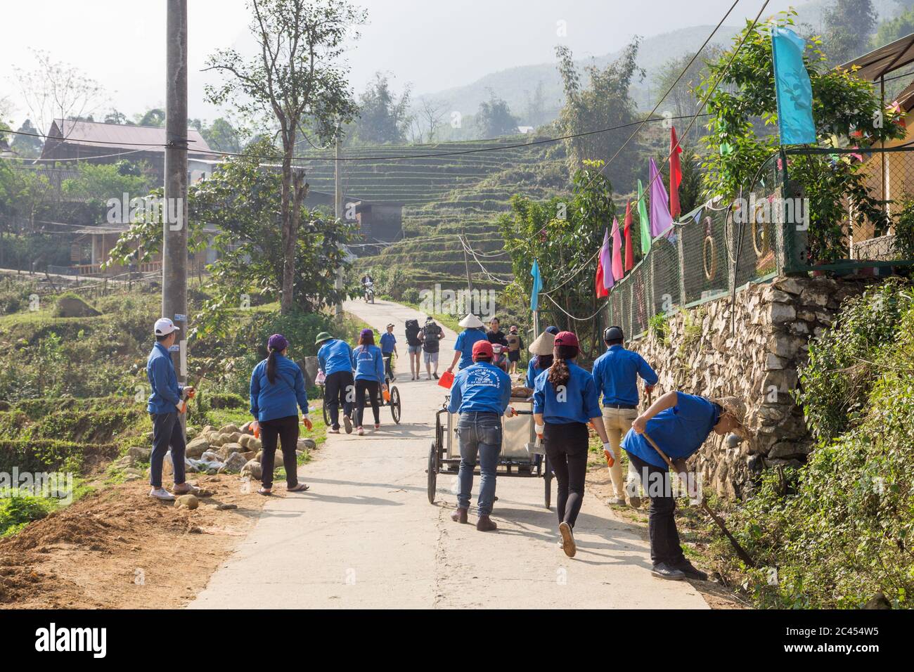 SAPA, VIETNAM - 23RD MARCH 2017: Workers cleaning the streets and roads ...