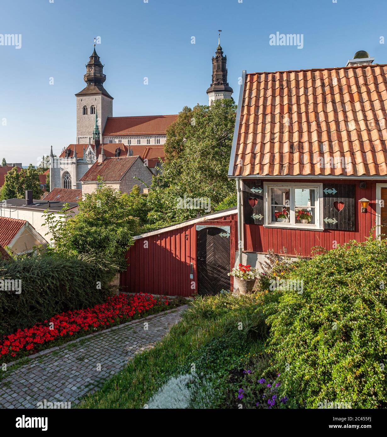 Small cottage and the cathedral in Visby, Gotland, Sweden, Scandinavia. Stock Photo