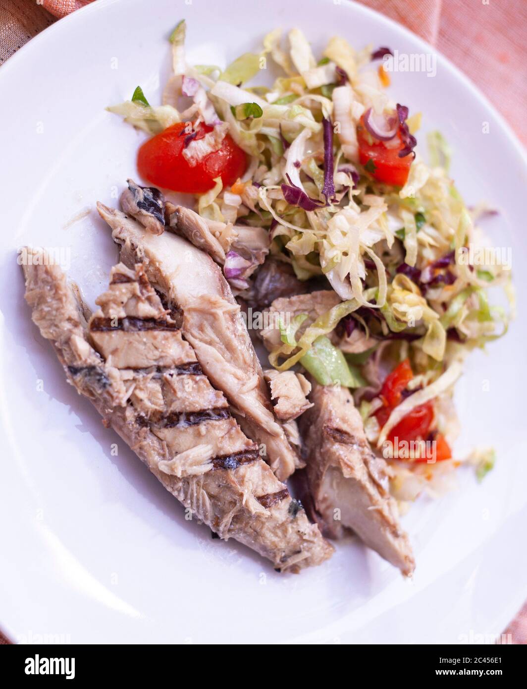 Grilled mackerel fillets with fresh salad and cherry tomatoes Stock