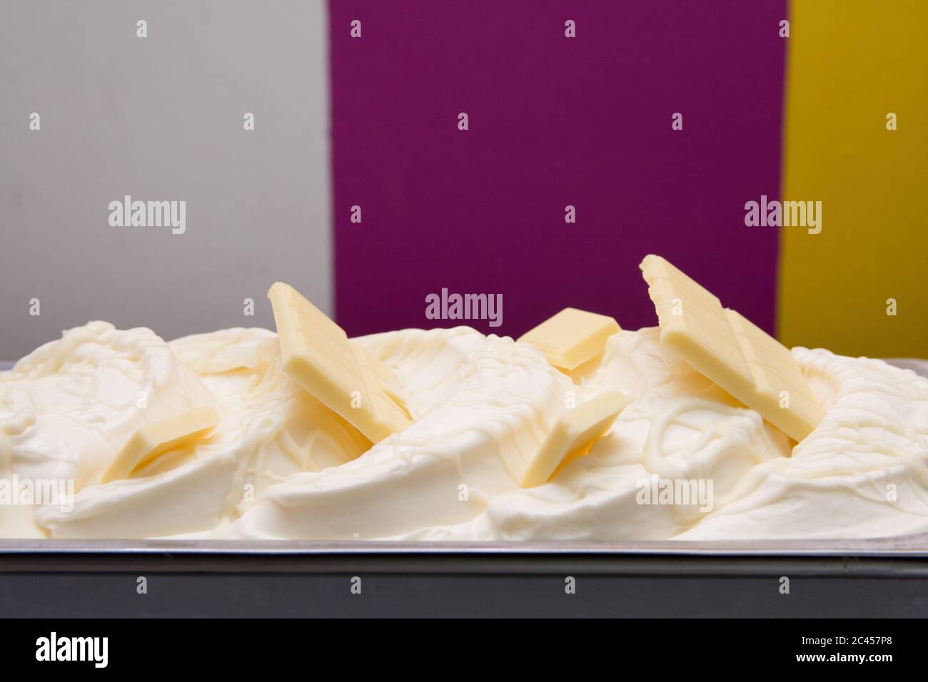 https://c8.alamy.com/comp/2C457P8/shot-of-yummy-vanilla-ice-cream-with-white-chocolate-in-a-steel-container-2C457P8.jpg