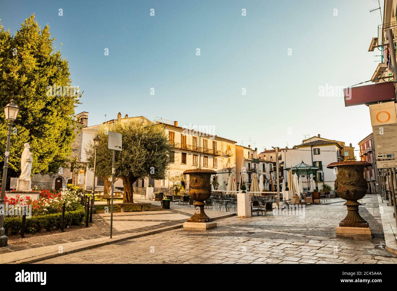 October 27, 2019 - Isernia, Molise, Italy - The deserted square in the city center. The closed umbrellas and the empty tables of the bars and restaura Stock Photo