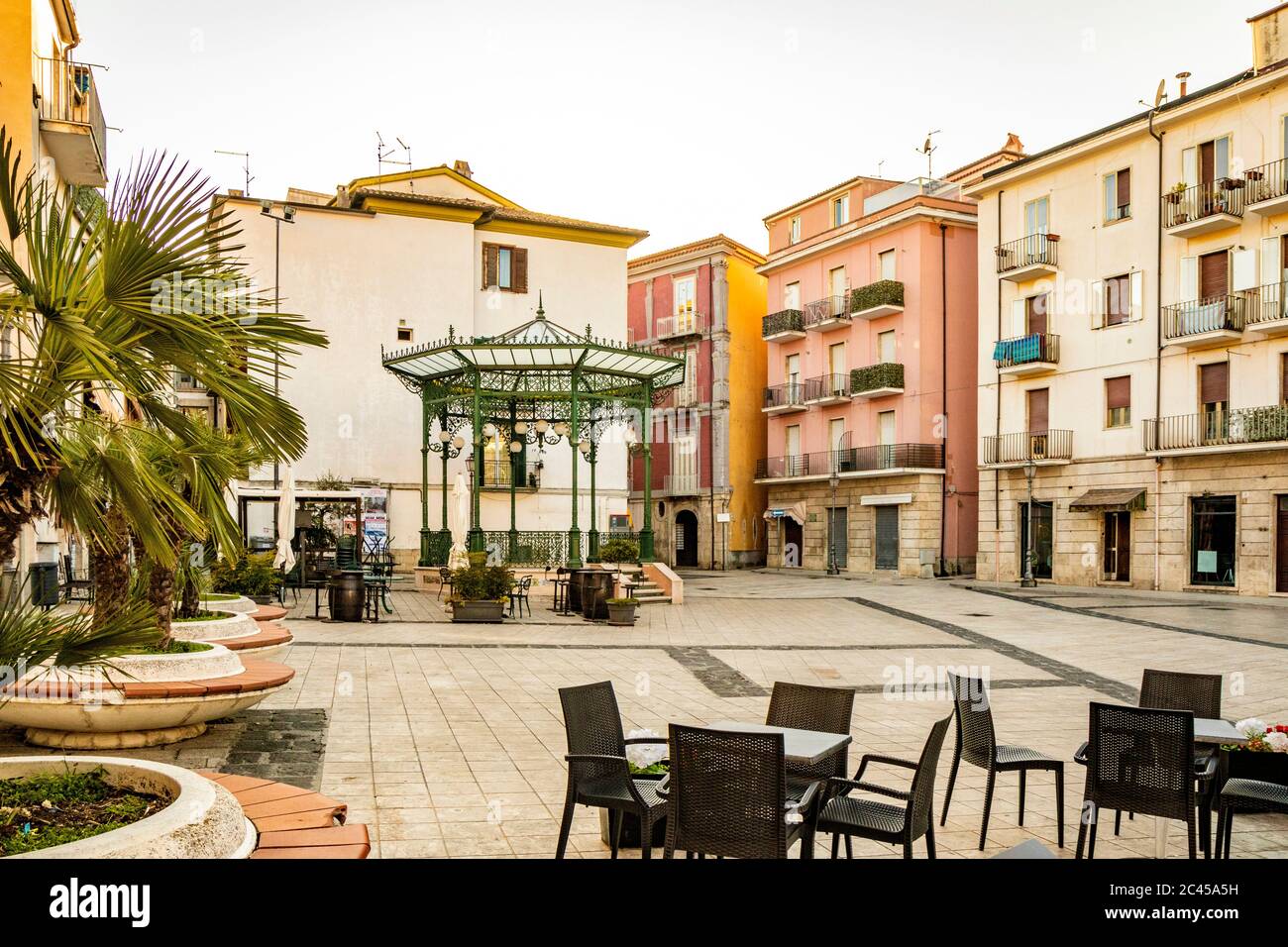 October 27, 2019 - Isernia, Molise, Italy - The deserted square in the city center. The empty tables of bars and restaurants in the evening. The Liber Stock Photo