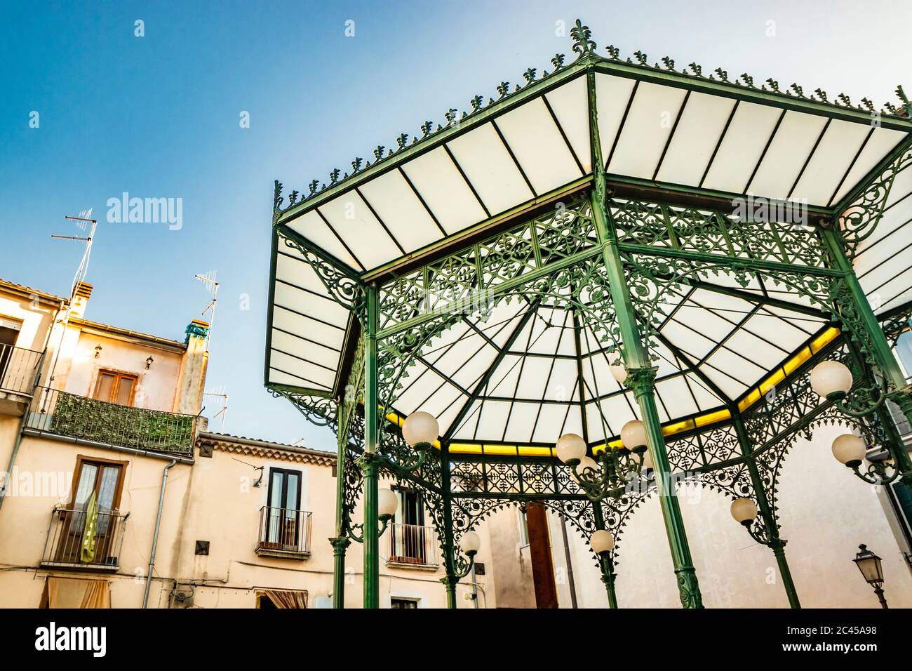 October 27, 2019 - Isernia, Molise, Italy - The Art Nouveau green wrought iron gazebo. The matt satined glass cover and floral decorations. The window Stock Photo